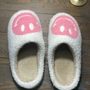 Pink smiley face slippers